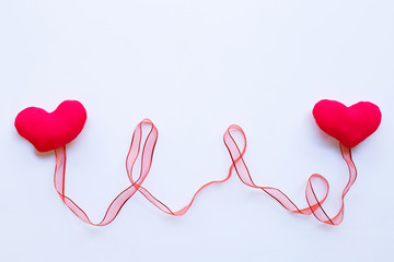 Valentine's hearts with red ribbon on white  background.