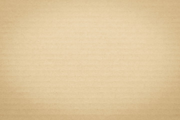 Light yellow brown cream color corrugated cardboard paper texture patterned background