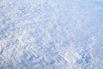 View from airplane, white clouds in rainy season and nice blue sky, bird eye view