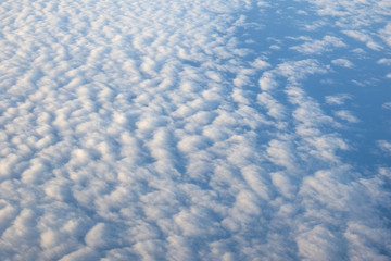 View from airplane, white clouds in rainy season and nice blue sky, bird eye view