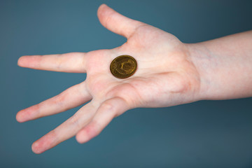 Hand with a coin