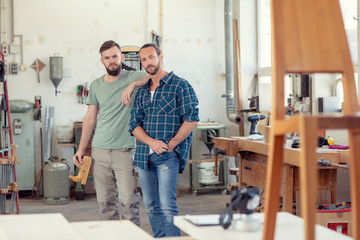 two worker in a carpenter's workshop