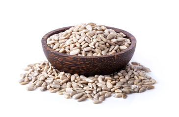 sunflower seeds in wood bowl isolated on white background