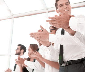 business background.applauding business team standing in the office