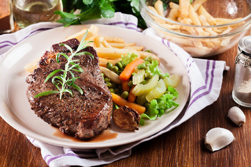 Beef steak served with baked potatoes