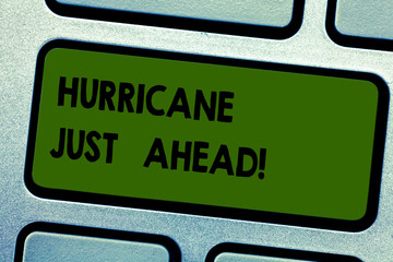 Text sign showing Hurricane Just Ahead. Conceptual photo violent tropical cyclone is approaching to hit the land Keyboard key Intention to create computer message pressing keypad idea