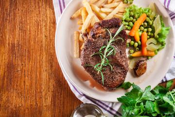 Beef steak served with baked potatoes