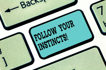 Fototapeta premium Conceptual hand writing showing Follow Your Instincts. Business photo text listen to your intuition and listen to your heart Keyboard key Intention to create computer message idea