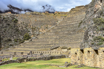 Cusco, Peru - Oct 22, 2018: Stone buildings and terraces at the Ollantaytambo archaeological site in the Sacred Valley
