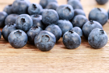 Blueberries on wooden table.
