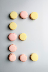 Alphabet letters made of sweet french macaroons.