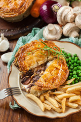 Homemade beef stew pie with french fries