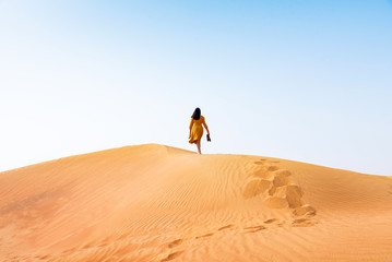 Woman walking in the desert © creativefamily