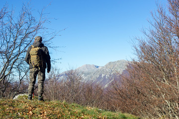 hiker on mountain peak mutria in italy matese