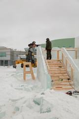 Two workers at the site of the ice camp