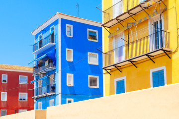 vacation travel tourism background - europe city color architecture buildings old red yellow blue buildings on sunny day spain villajoyosa 