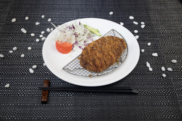Close up view of plate with japanese food inside. Japan traditional food on wooden table.