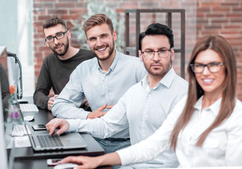 employees of the business center, sitting in the computer room