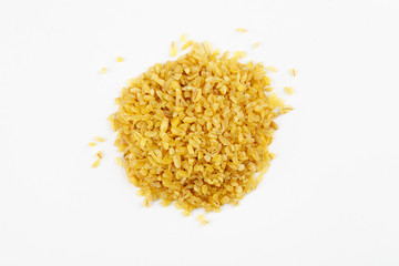 Pile of raw bulgur seeds on a white background