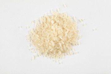 Fototapeta na wymiar Pile of white rice on a white background