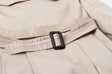 Beige trench coat belt close-up