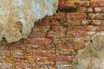 Oldest brick wall with plaster background. Old vintage texture with copy space