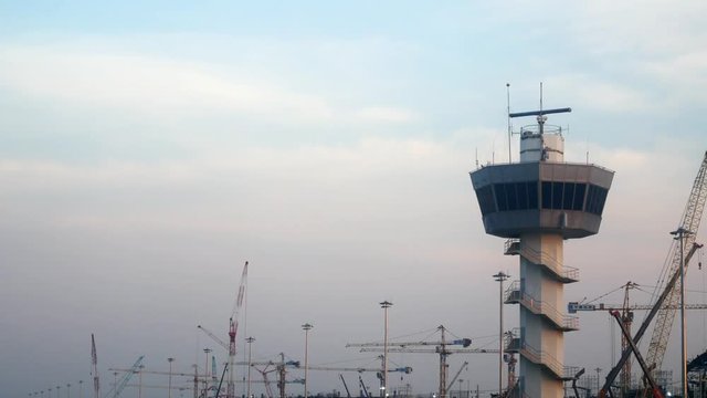 Air traffic control tower (atc) with radar is working on the top of the tower
