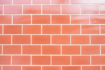 Red brick wall background with light reflection