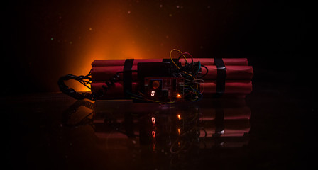 Image of a time bomb against dark background. Timer counting down to detonation illuminated in a...