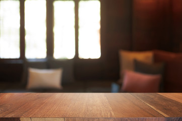 Fototapeta na wymiar wooden table with blurred modern home background