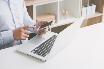 male hands using mobile smart phone for payment and entertainment