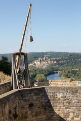 Medieval trebuchet at Chateau de Castelnaud, medieval fortress at Castelnaud-la-Chapelle, Dordogne,...