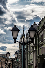 Fototapeta na wymiar Old lanterns on the background of cloudy sky