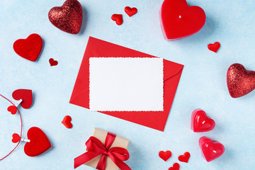 Valentines day background. Envelope, greeting card, gift box and red hearts for holiday message.