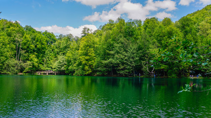 Beautiful lake view landscape. Sky and tree reflection on lake in Yedigoller Nature Park, Bolu District in Turkey. Amazing collaboration of blue and green. Multiple colors and amazing lake scenery. 