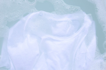 Soak cloth before washing, white t-shirt