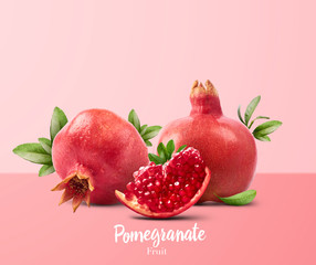 Fresh ripe pomegranate with green leaves isolated on white background.