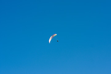 Paroplan on a blue sky on a sunny day