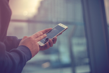 social mobile phone for connect to network internet technology with town city background