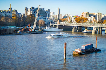 The view across the river thames with hungerford and jubilee bridges