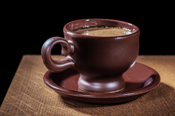 espresso in clay coffee cup