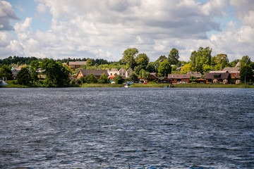 Fototapeta na wymiar TRAKAI, LITHUANIA: Uzutrakis manor on the board of Galves lake near Trakai town
