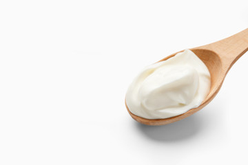 Spoon with yogurt, copy space