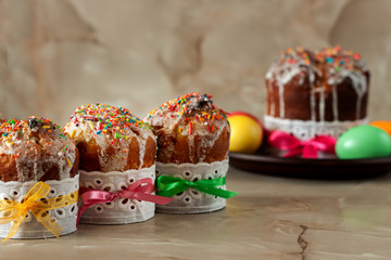 Freshly baked Easter cake with colored eggs is on the table