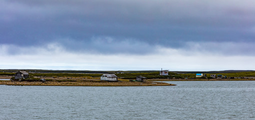 Huts dot Arctic Ocean Coastline NWT Canada