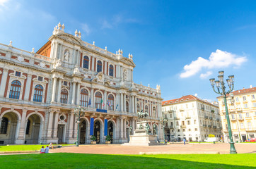 Fototapeta na wymiar Turin, Italy, September 10, 2018: Facade of Palazzo Carignano palace Museum baroque rococo style old building on Piazza Carlo Alberto square, green lawn in historical centre of Torino city, Piedmont