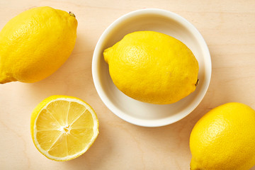 Fototapeta na wymiar Fresh lemon in bowl on wooden table. 
