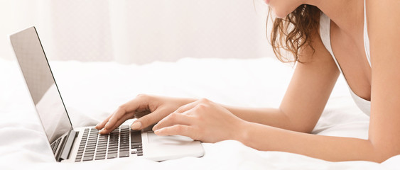 Young woman browsing work opportunities on laptop