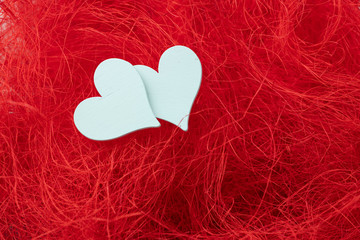 valentines love hearts on red straw background