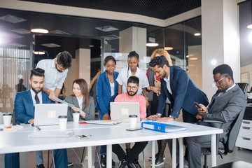 happy diverse talented people are working in the office. leadership, friendship